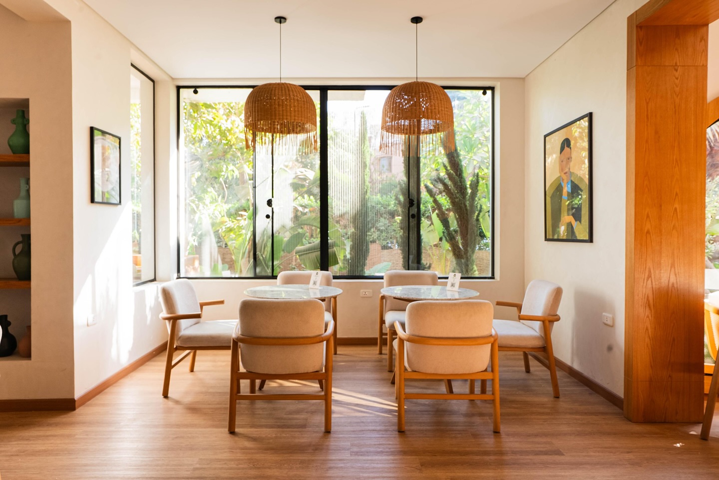 Bright dining area with rattan lamps