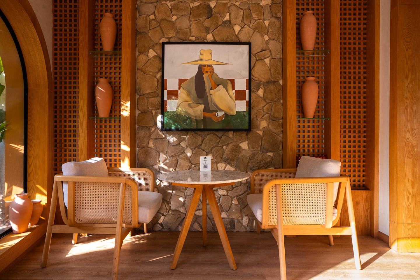 Cosy corner with stone wall and art