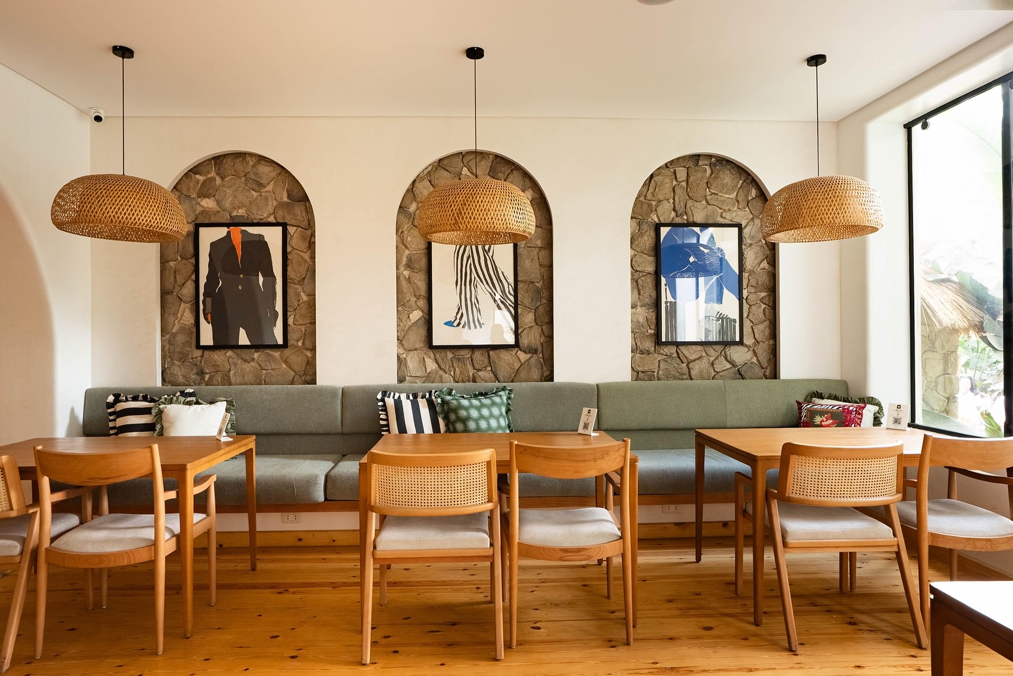 Banquette seating beneath arched niches